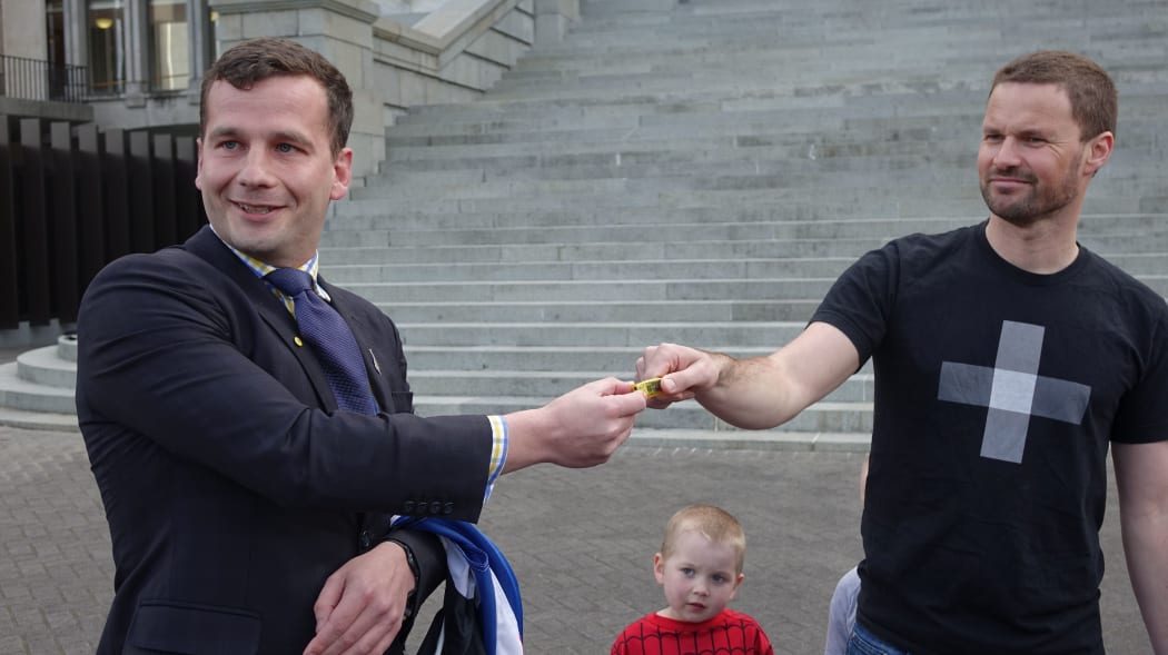 David Seymour receives the USB stick petition.