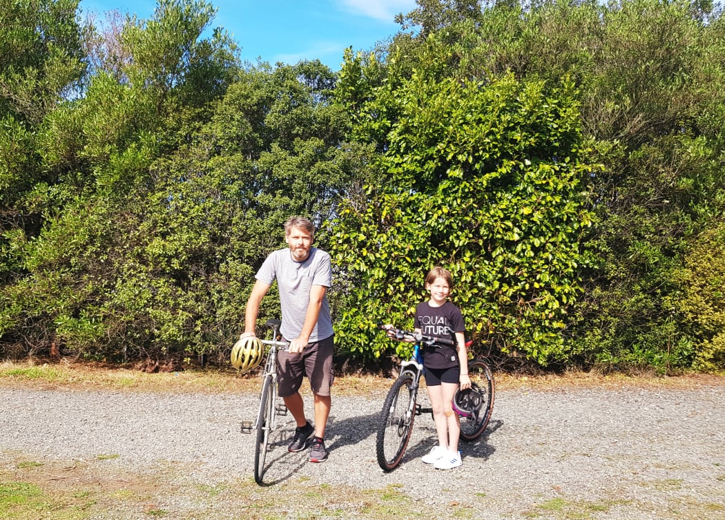 Josh Barraud and his daughter on a bike ride in Wairarapa