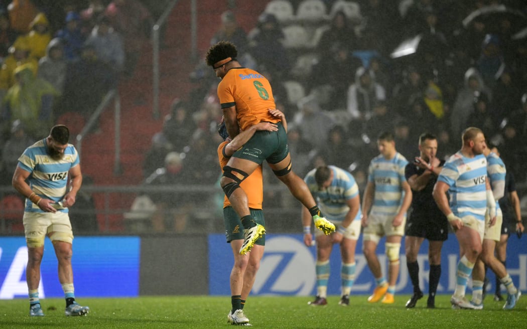 Wallabies loose forward Rob Valetini, top, and centre Hamish Stewart celebrate victory after beating Argentina in a Rugby Championship Test match at the UNO Jorge Luis Hirschi Stadium in La Plata, Buenos Aires Province. , on August 31, 2024.