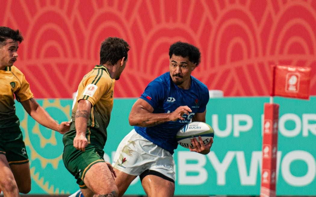 Winger Va’afauese Maliko on the attack against Brazil in Dubai. He scored a try in the 48-10 win.