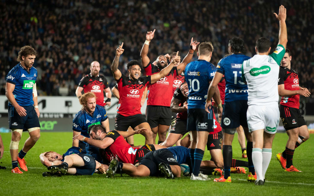 Crusaders celebrate a Bryn Hall try during the Final of the Super Rugby Paciﬁc rugby match between the Blues and the Crusaders held at Eden Park on 18 June 2022.