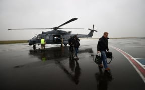 Chris Hipkins boards a helicopter for a flight from Napier to Wairoa after the devastation of cyclone Gabrielle. The flight had to be abandoned due to low cloud.
