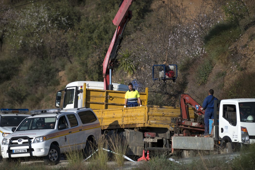 Rescue workers continue efforts to find a boy who fell down a well in Totalan in southern Spain on January 16, 2019.