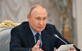 In this pool image distributed by Sputnik agency, Russia's President Vladimir Putin chairs a State Council meeting on public transport development in Moscow's Kremlin, on August 17, 2023. (Photo by Sergei GUNEYEV / POOL / AFP)
