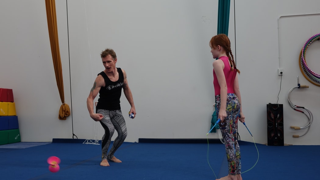 Daniel Syme with a student.