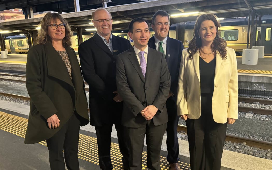 From left, Horizons Regional Council chair Rachel Keedwell, Greater Wellington Regional Council chair Daran Ponter, Transport Minister Simeon Brown, Hutt South MP Chris Bishop and Finance Minister Nicola Willis, at Wellington Railway Station for the announcement of an $800m upgrade for lower North Island commuter rail, 25 July 2024.