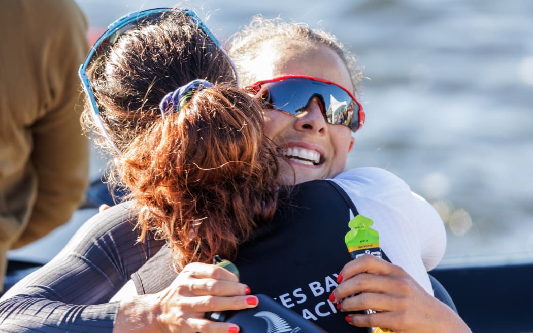 Lisa Carrington congratulates Aimee Fisher on winning the K1 500m final during the NZ Canoe Sprint Championships 2022 at Lake Karapiro.