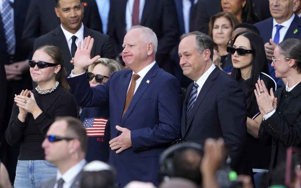 WASHINGTON, DC - NOVEMBER 06: (L-R) Hope Walz, Democratic vice presidential nominee, Minnesota Gov. Tim Walz, Second gentleman Doug Emhoff and Ella Emhoff react as Democratic presidential nominee, U.S. Vice President Kamala Harris concedes the election, at Howard University on November 06, 2024 in Washington, DC. After a contentious campaign focused on key battleground states, the Republican presidential nominee, former U.S. President Donald Trump was projected to secure the majority of electoral votes, giving him a second term as U.S. President. Republicans also secured control of the Senate for the first time in four years.   Kent Nishimura/Getty Images/AFP (Photo by Kent Nishimura / GETTY IMAGES NORTH AMERICA / Getty Images via AFP)