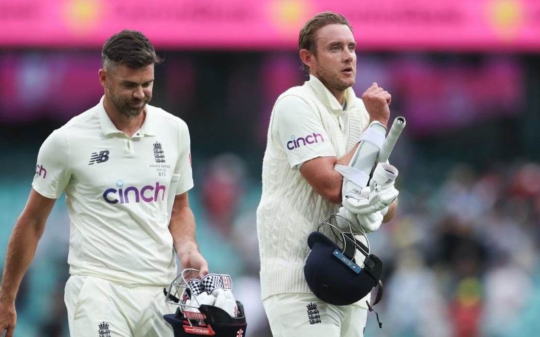 Stuart Broad and James Anderson of England leave the field as the match ends in a draw. Fourth Ashes test, Sydney, Jan 2022.