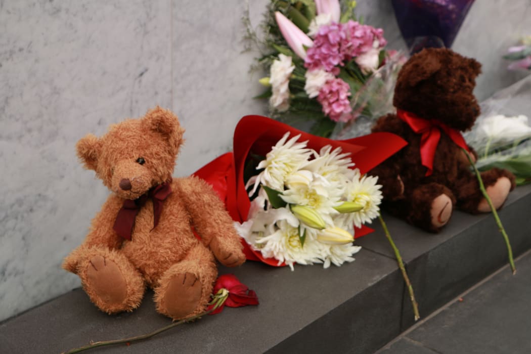 Flowers and toys were placed at the memorial for those who died.