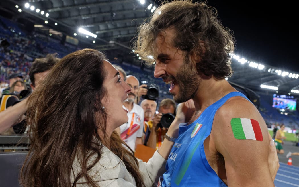Gianmarco Tamberi of Team Italy celebrating his wife Chiara Bontempi after winning the gold medal in the Men's High Jump Final during day five of the 26th European Athletics Championships at Stadio Olimpico in Rome, Italy, on 11 June, 2024.