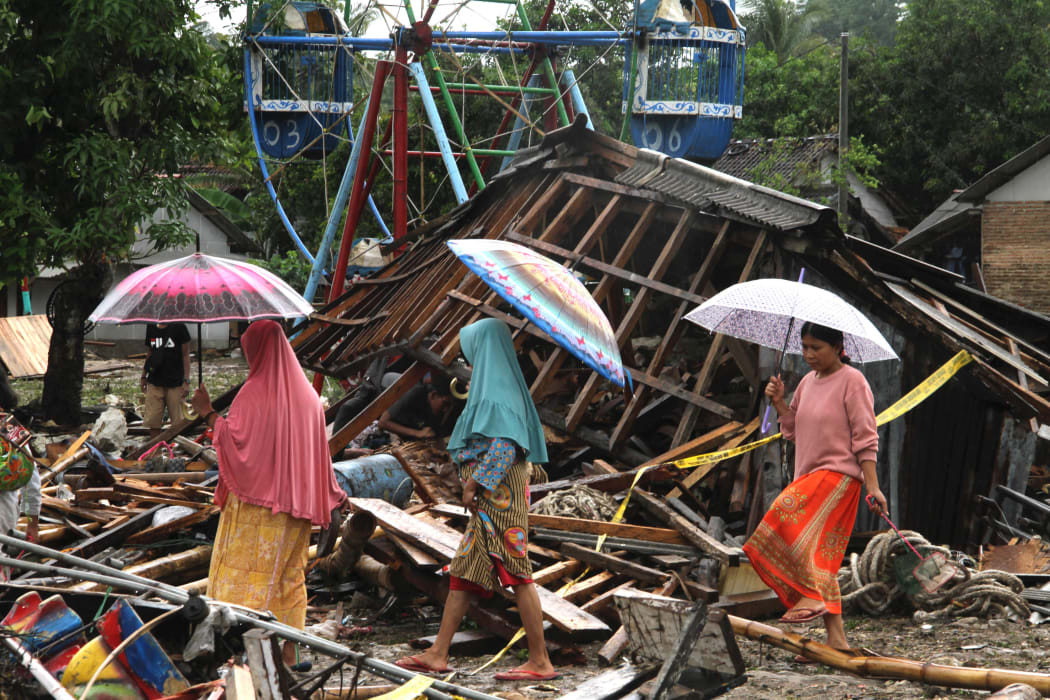 Residents search through debris in Tanjung Lesung, Banten province on December 24.