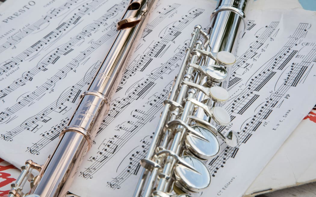 Flutes on music manuscript.