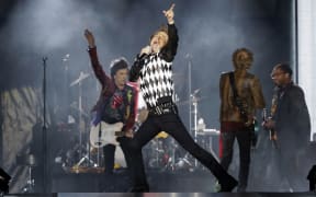 Ronnie Wood (L), Mick Jagger (C), Charlie Watts (partially hidden) and Keith Richards of the Rolling Stones perform as they resume their "No Filter Tour" North American Tour at the Soldier Field on June 21, 2019 in Chicago.