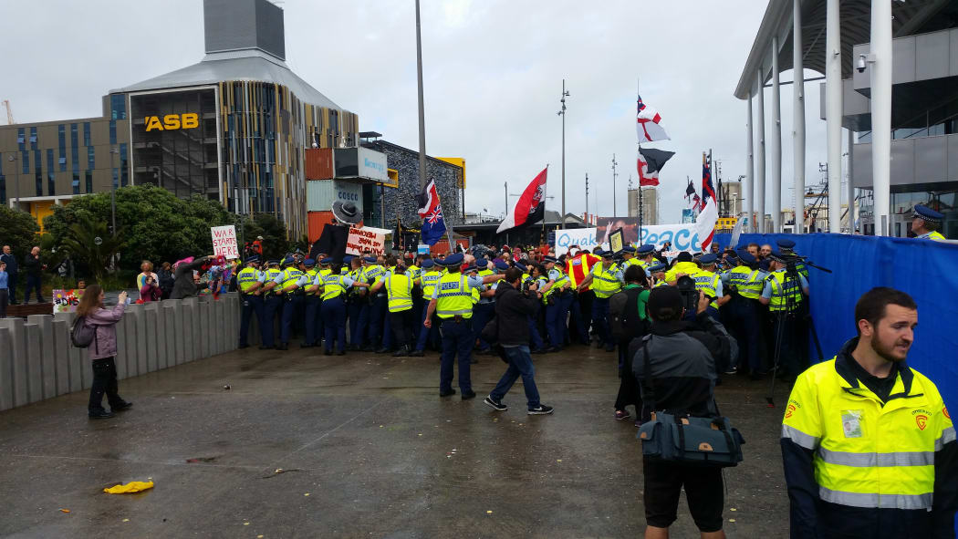 Police are attempting to stop the protesters from crossing a blockade at the Viaduct Events Centre.