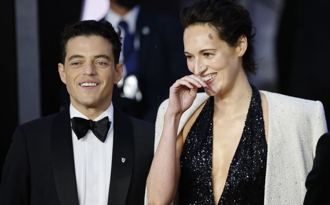 US actor Rami Malek (L) and screenwriter Phoebe Waller-Bridge pose on the red carpet world premiere of the latest James Bond film, "No Time To Die".