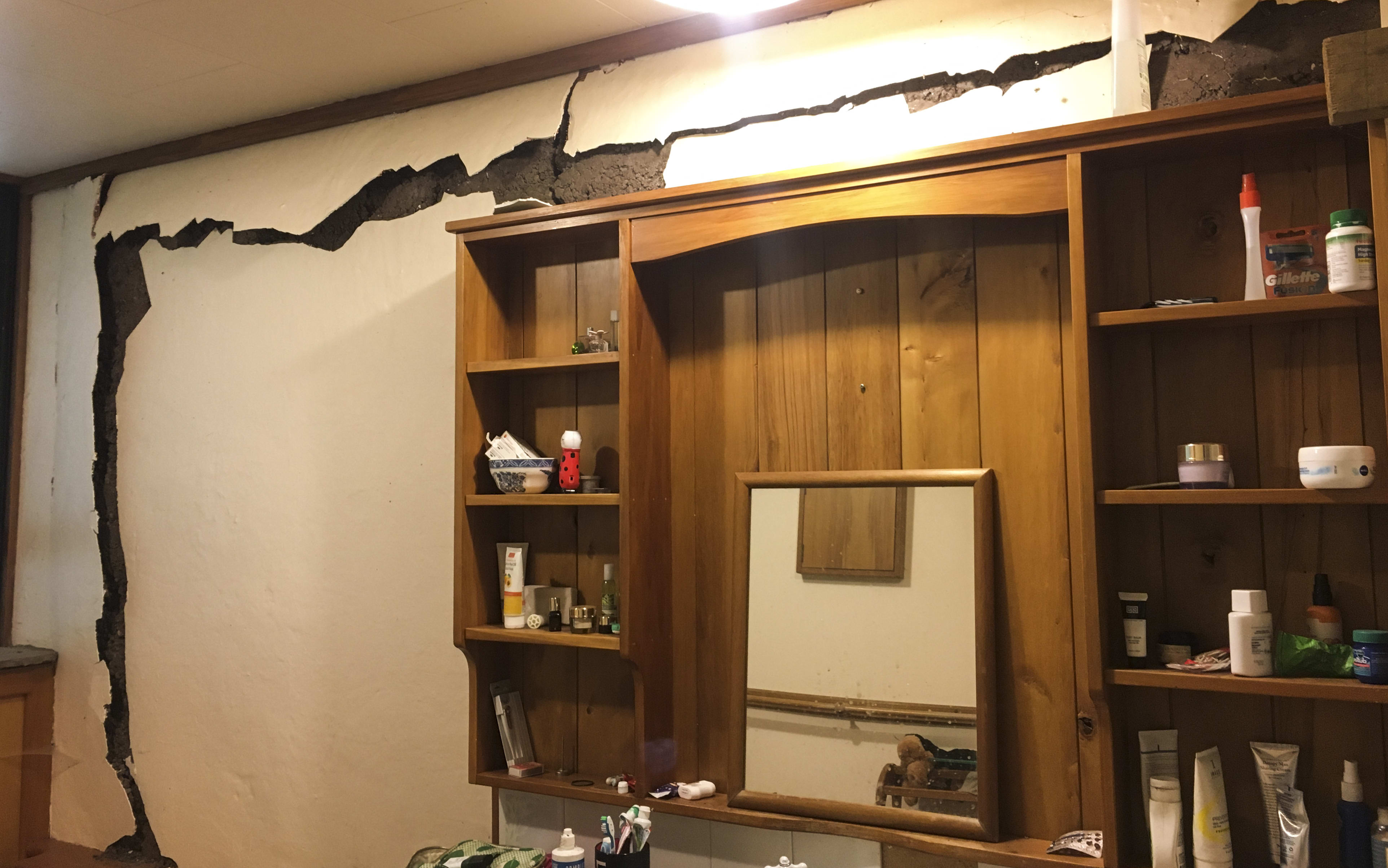 Damage in the newer homestead's bathroom where the walls have come away from structural pillars