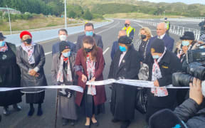 Prime Minister Jacinda Ardern cuts the ribbon on Transmission Gully during the opening ceremony, 30 March 2022.