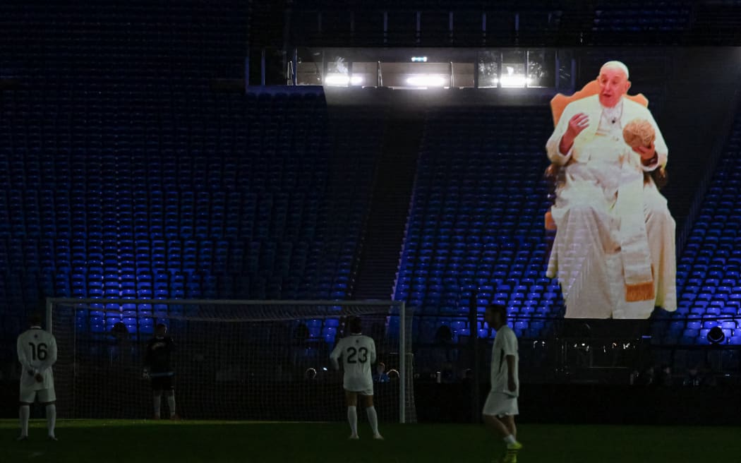 A hologram of Pope Francis giving a message of peace is displayed during a friendly tribute "match for peace" in memory of late Argentininan player Diego Maradona, in November 2022 at the Olympic stadium in Rome.