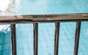 A swimming pool with gate access.