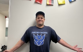Brad Warrington wearing a NZ music T-shirt for NZ Music T-shirt Day 2024