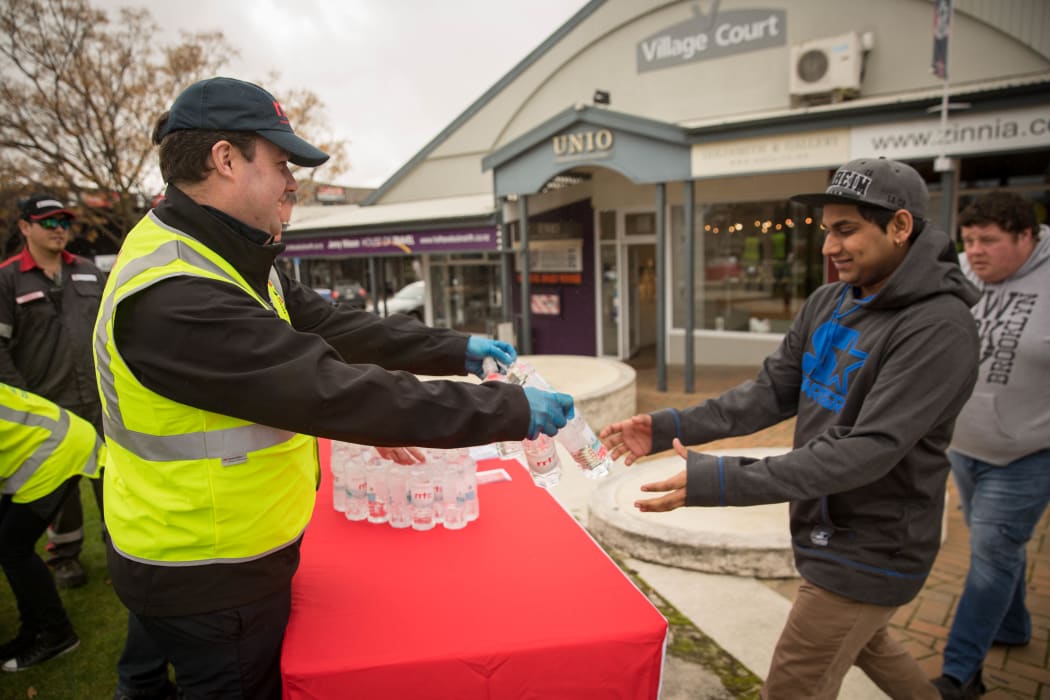 Red Cross volunteers handing out water in Havelock North. 20 August 2016.