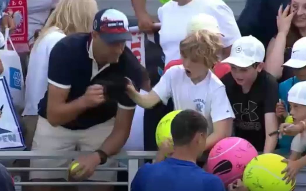 Piotr Szczerek snatched the hat that was intended to go to the child.