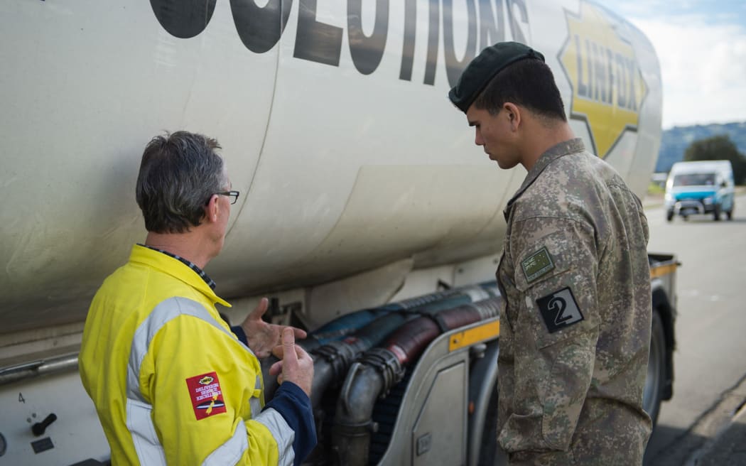 A Defence Force driver preparing to help deliver fuel.