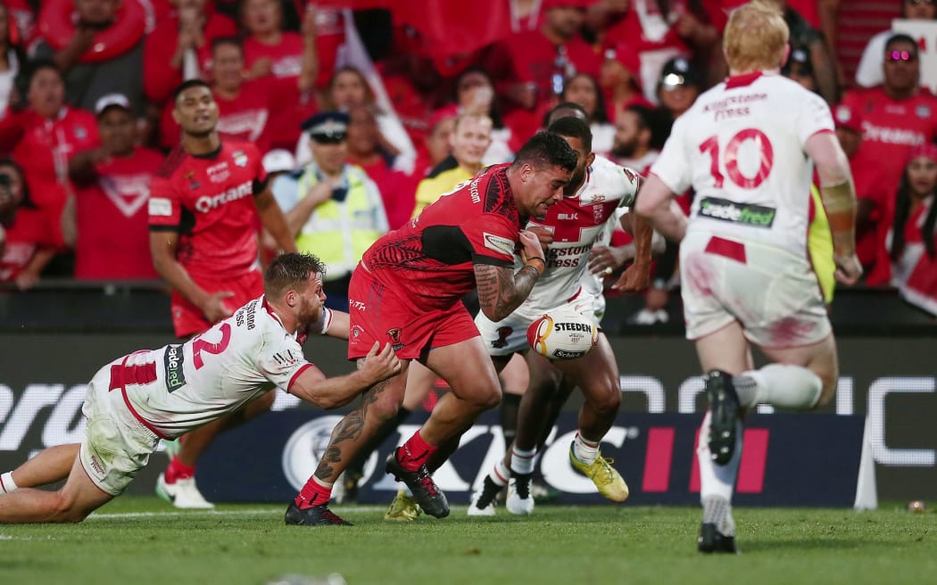 Andrew Fifita of Tonga loses the ball during the final play of the match against England.