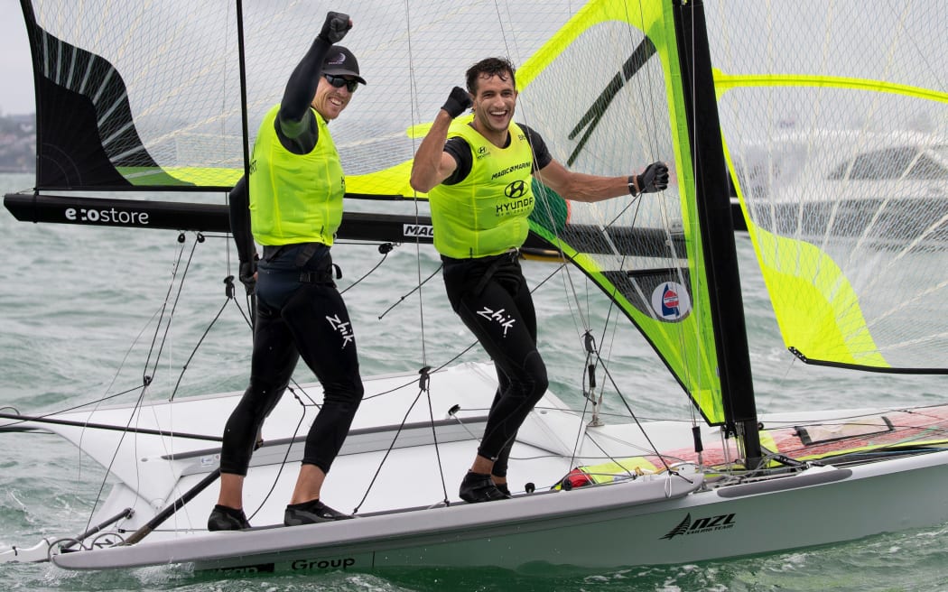 Blair Tuke and Peter Burling celebrate their fifth world title