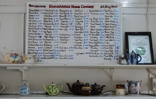 The bakery’s hand-written price list.
