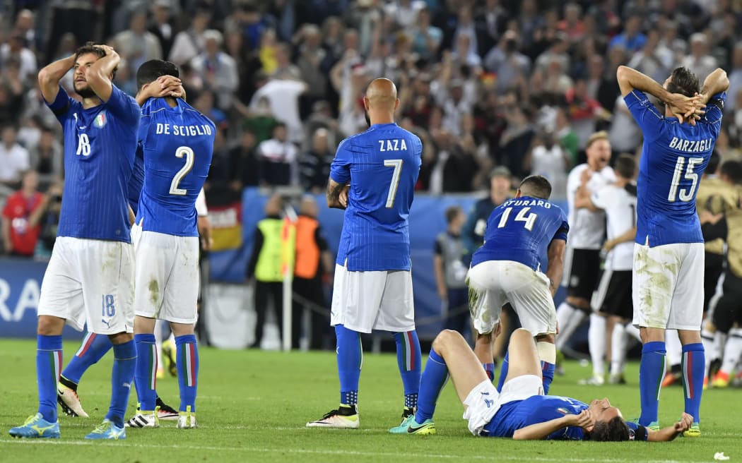 Italy players react during their Euro 2016 quarter-final penalty shootout defeat to Germany