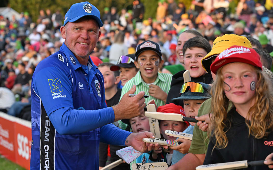 Team Cricket's Lou Vincent signs autographs during the T20 Black Clash cricket match in Christchurch.