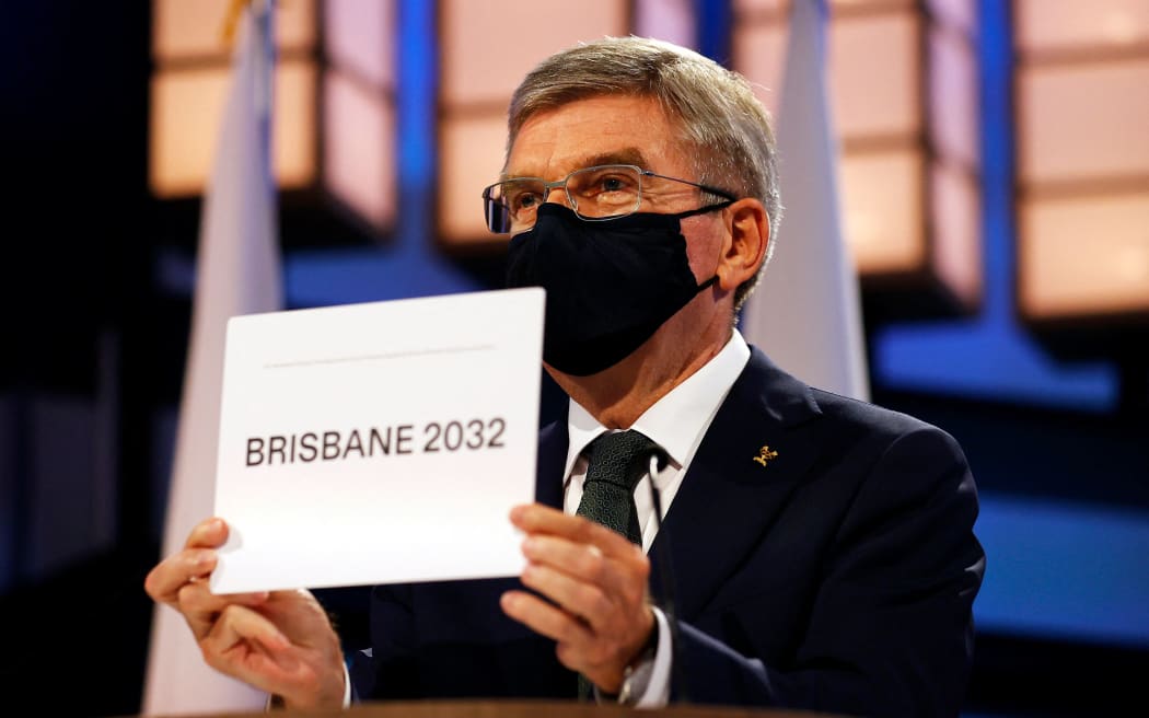 President of the International Olympic Committee Thomas Bach announces Brisbane as the 2032 Summer Olympics host city during the 138th IOC Session in Tokyo on July 21, 2021.