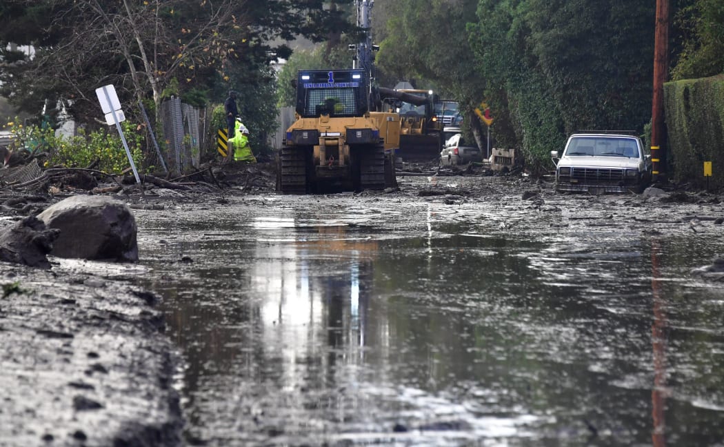 Mudslides unleashed by a ferocious storm demolished homes in southern California and killed at least 13 people, police said Tuesday.