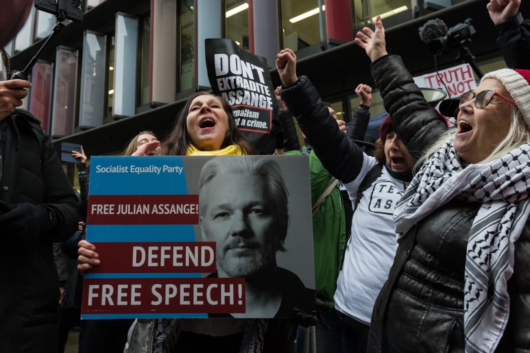 Supporters of Julian Assange cheer outside the Central Criminal Court (Old Bailey) after a judge ruled he should not be extradited to the United States on 4 January, 2021 in London, England.