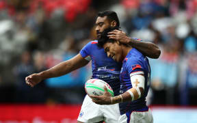 Samoa captain David Afamasaga and Murphy Paulo celebrate a try.