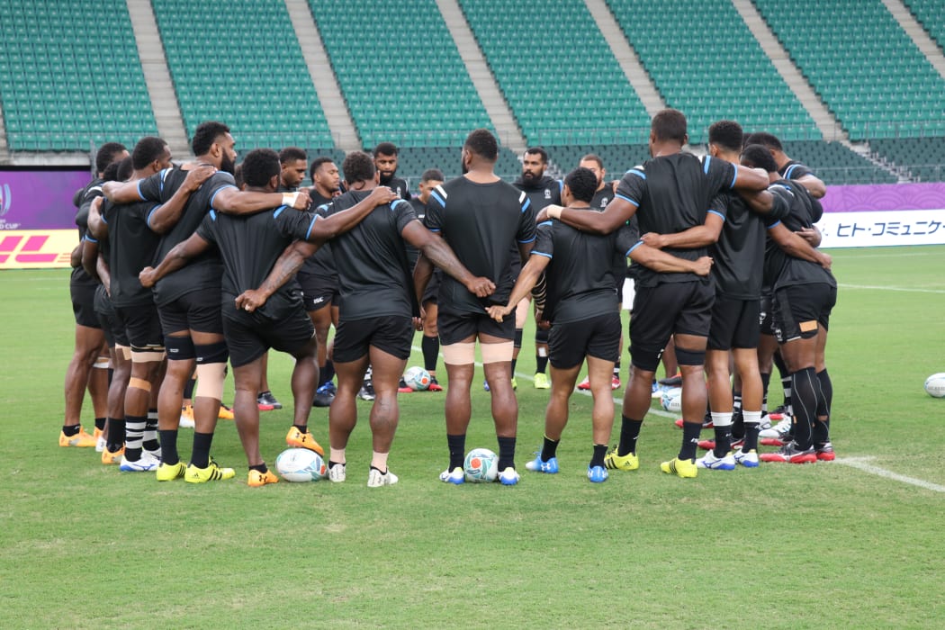 Fiji huddle together during their captain's run in Oita.