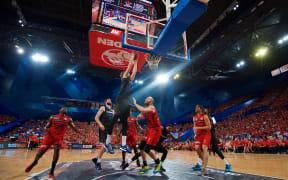 Thomas Abercrombie of the New Zealand Breakers drives for a dunk.