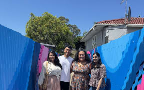 Auckland Transport's Ryan Clarke, and resident, Jenna Toeono (middle), at the upgraded alleyway.