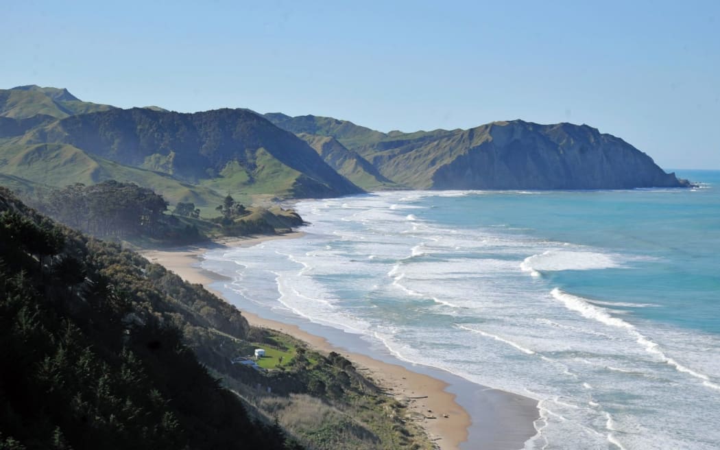 Normally a popular camping spot in summer, Waihau Bay is now a ghost town after a large slip took out the only access road about one kilometre from the beach community.