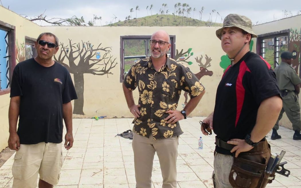 NZ High Commissioner, Mark Ramsden, surveys damage.  (Centre).