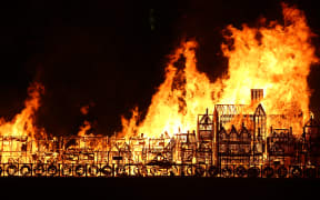 A replica of 17th-century London on a barge floating on the river Thames is set ablaze in an event to mark the 350th anniversary of the Great Fire of London.