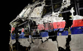 The wrecked cockipt of the Malaysia Airlines flight MH17 is exhibited during a presentation of the final report on the cause of the its crash at the Gilze-Rijen Air Base on 13 October 2015.