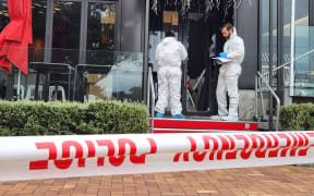 Investigators at the scene of a robbery at Tokyo Bay restaurant, North Shore, Auckland.