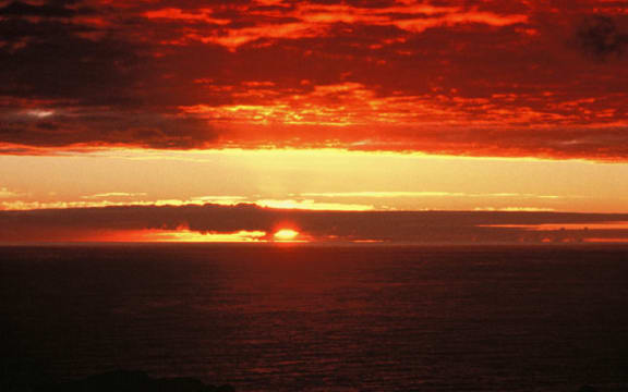 The Chatham Islands sunrise on the first morning of the year 2000. Sourced from Te Ara.