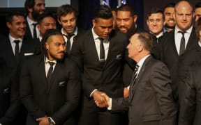 John Key congratulates squad members.
