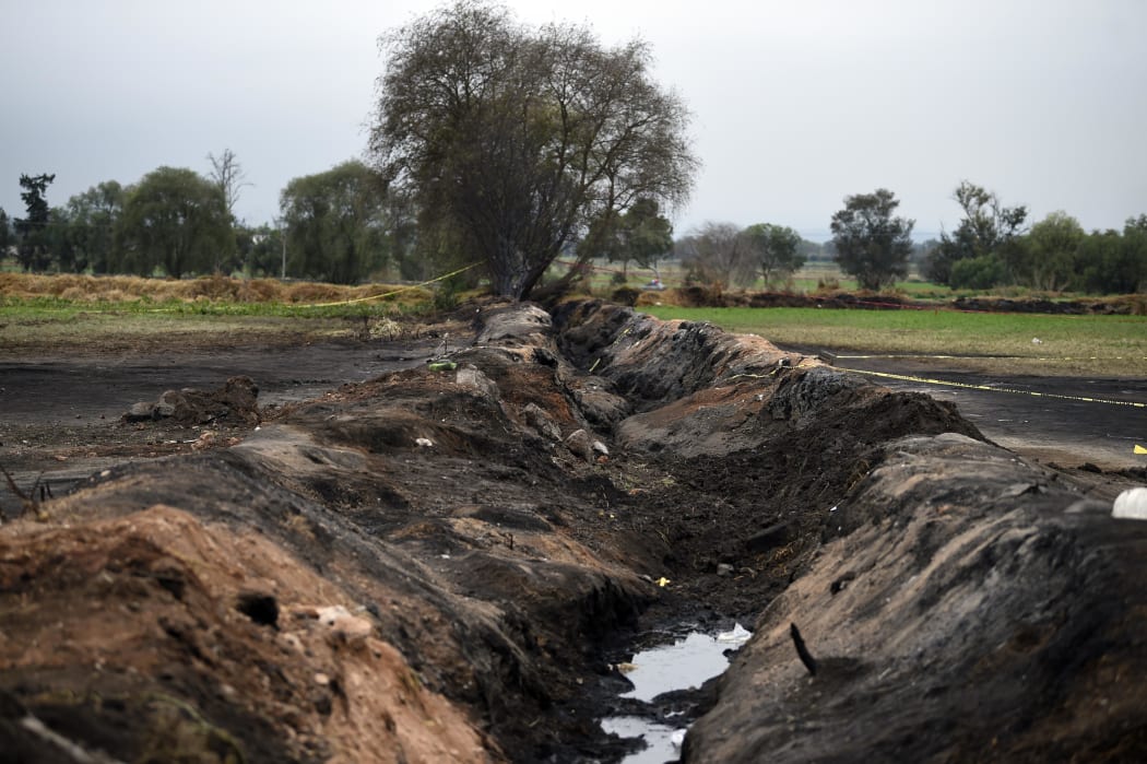 General view of the site where a massive blaze trigerred by a leaky pipeline took place in Tlahuelilpan, Hidalgo state, Mexico on January 20, 2019.