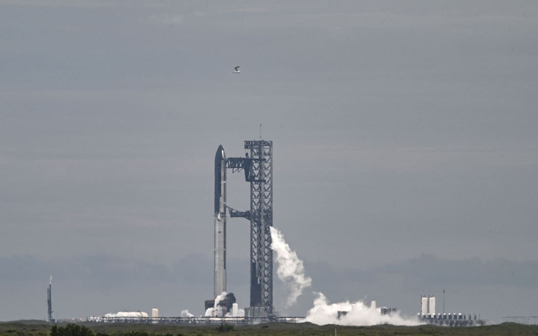 SpaceX's Starship is seen on the launchpad in Starbase, Texas, on August 24, 2025. SpaceX canceled a planned test flight for its Starship megarocket on August 24, saying it needed time to troubleshoot problems, in the latest setback for Elon Musk's behemoth after a series of explosive failures. The problems have led some observers to doubt whether the world's biggest and most powerful launch vehicle will be capable of taking humans back to the Moon -- or achieving Musk's dreams of colonizing Mars. (Photo by RONALDO SCHEMIDT / AFP)