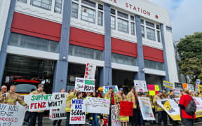 Firefighters on strike outside Auckland Central Fire Station.